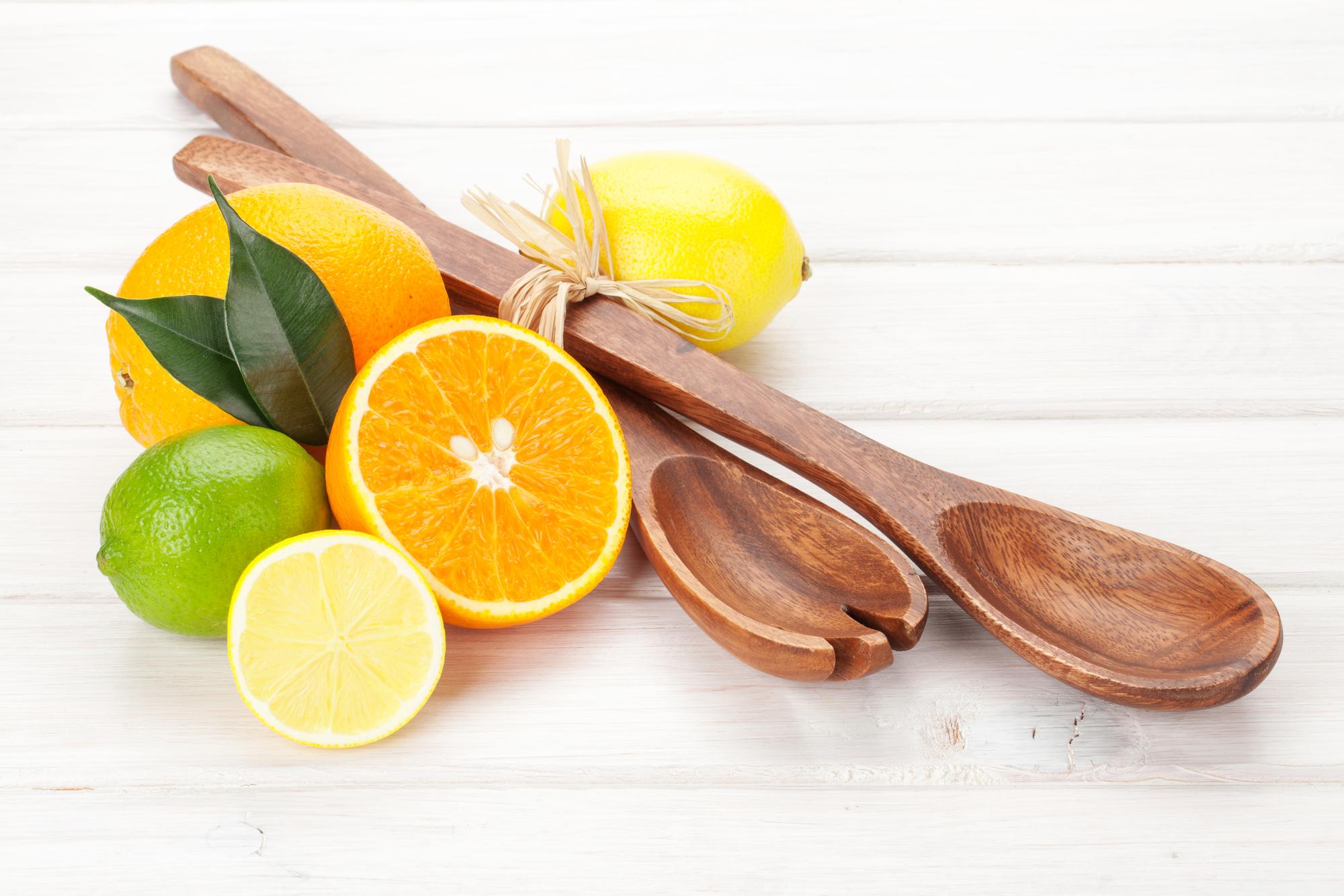 Sliced citrus and utensils